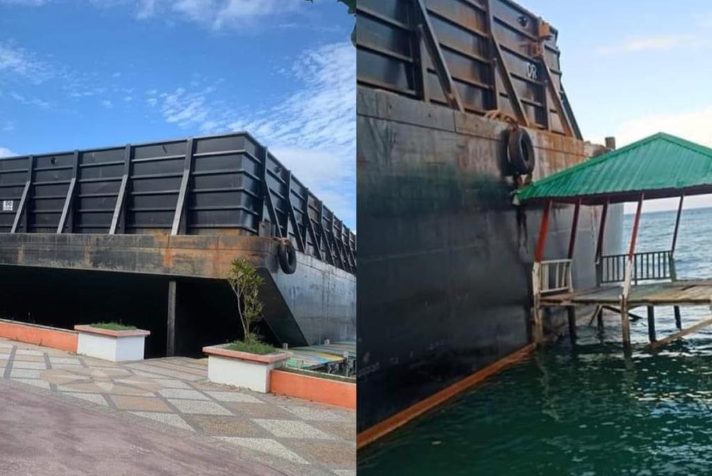 Kapal tongkang tertulis MBS 392 Banjarmasin diduga terdampar lalu menabrak area destinasi wisata Pantai Berova, Kolaka Utara. Foto: Istimewa.